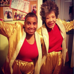 Would-be emcees Eileen Schofield and Debora Green sport the outfits they would have worn for the solidarity talent show had it not been canceled. Photo by Sarah Ruszkowski