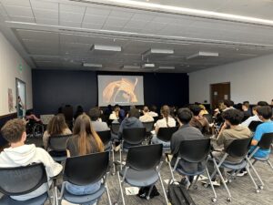 A group of Georgetown University students viewing On Loneliness in a classroom setting