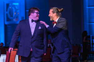 Reilly and Michael, Everable film crew members, walking to the stage to receive their Emmys for On Loneliness